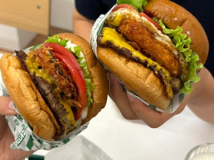 Taking a bite of the burger