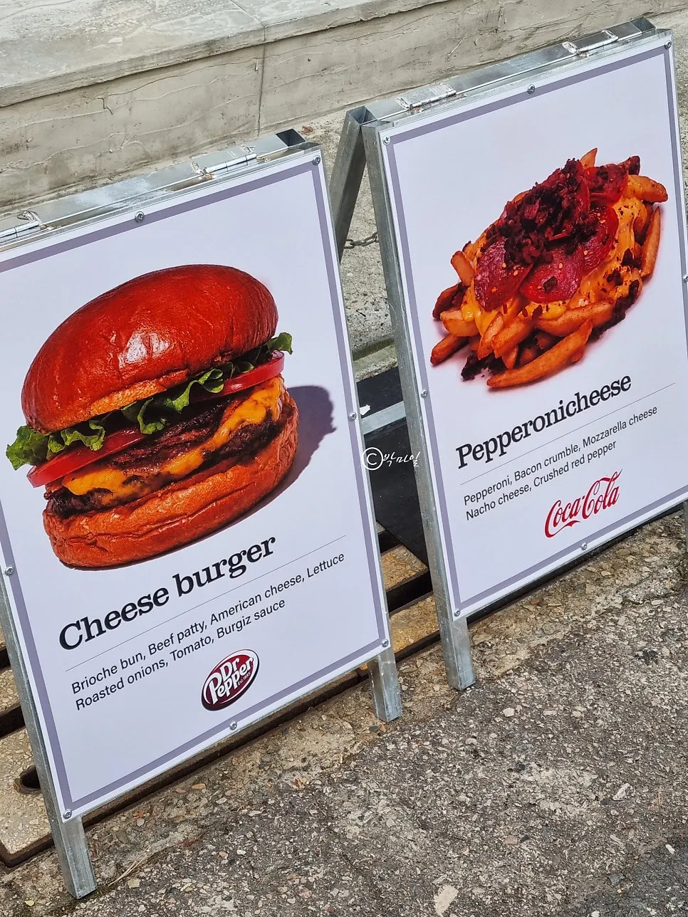 Sign listing fries and side menu items