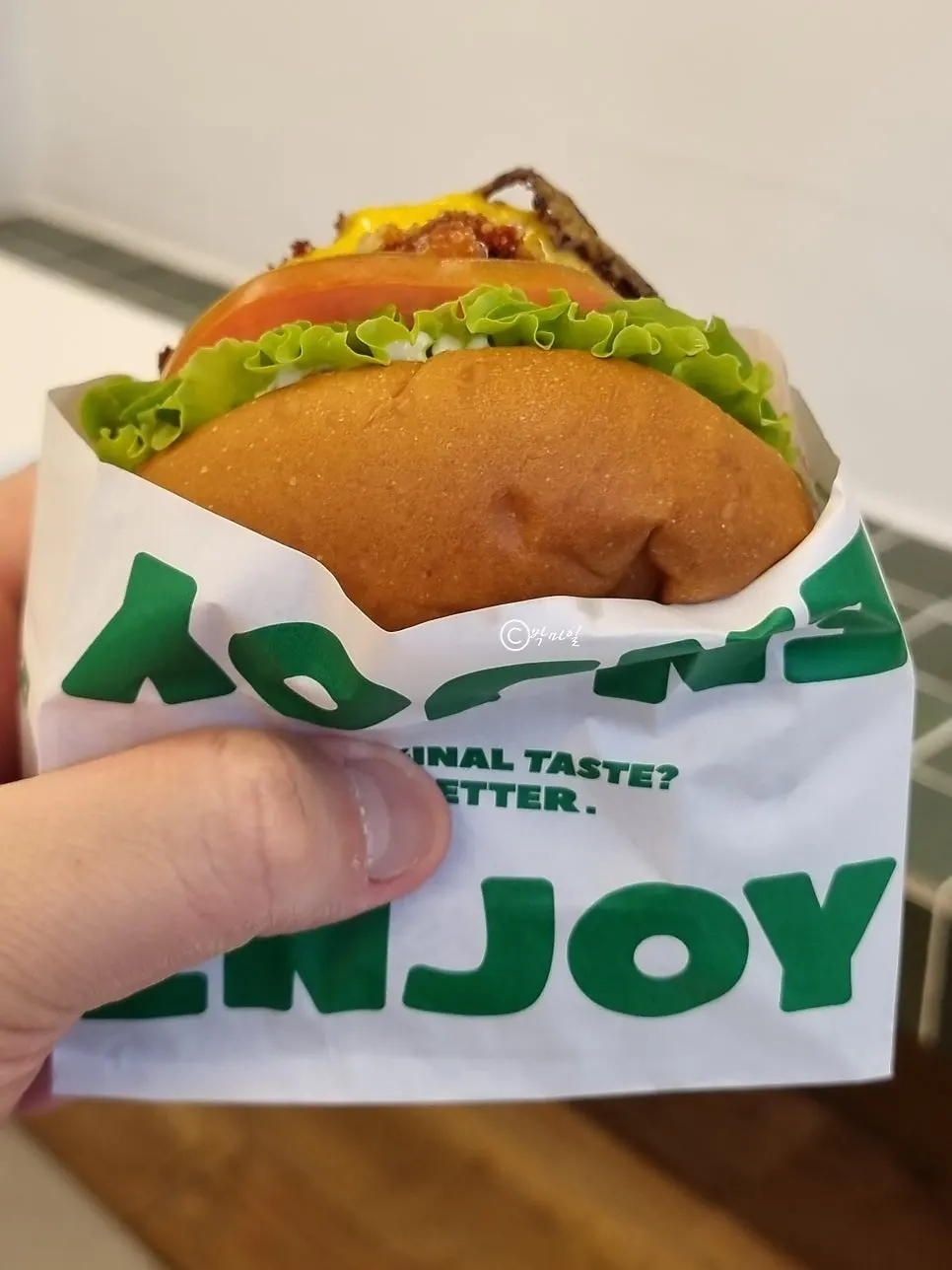 Cross-section of the Avocado burger with whole bacon