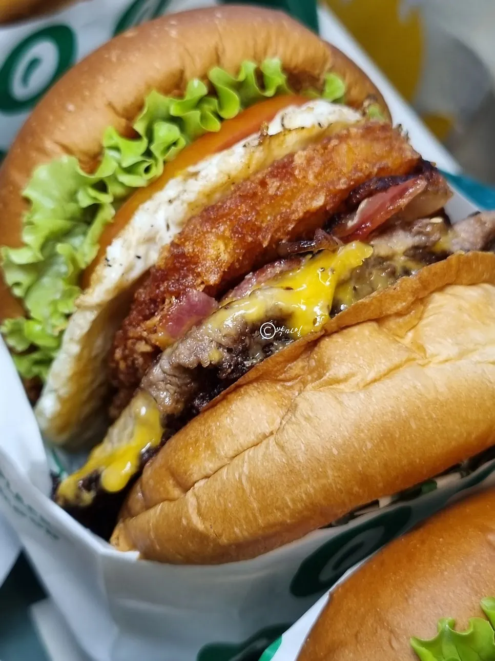 Hangover burger topped with hash brown and soft-boiled egg