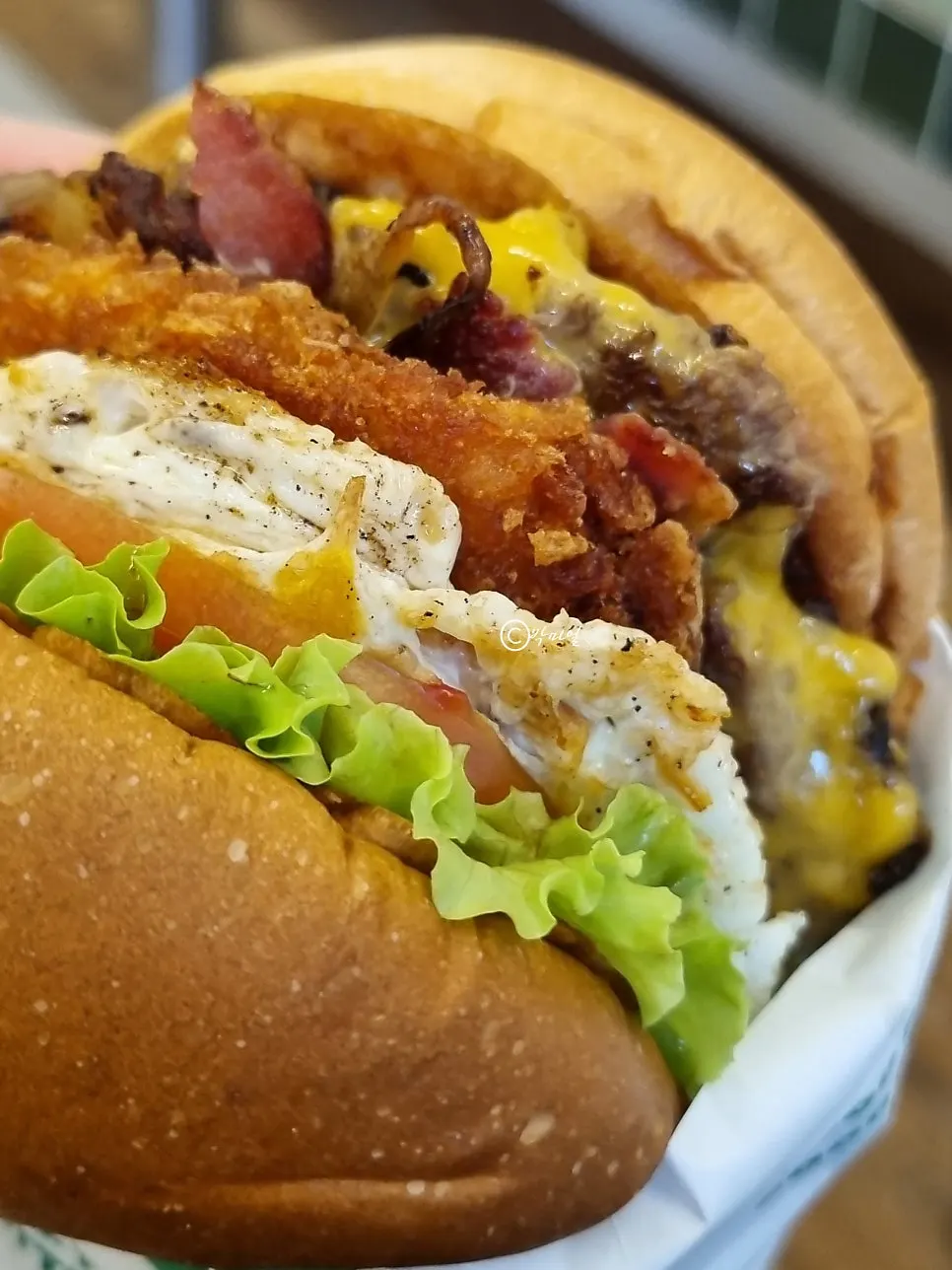 Cross-section of the Hangover burger showing the thick patty