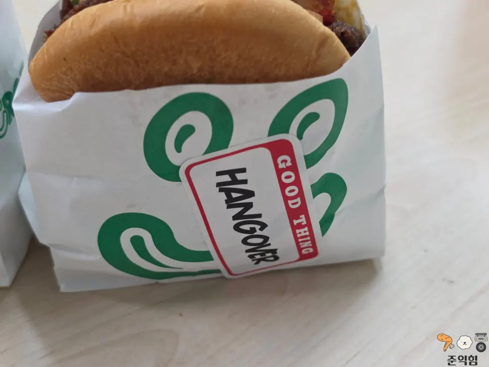 Burger packaging with menu-identifying stickers