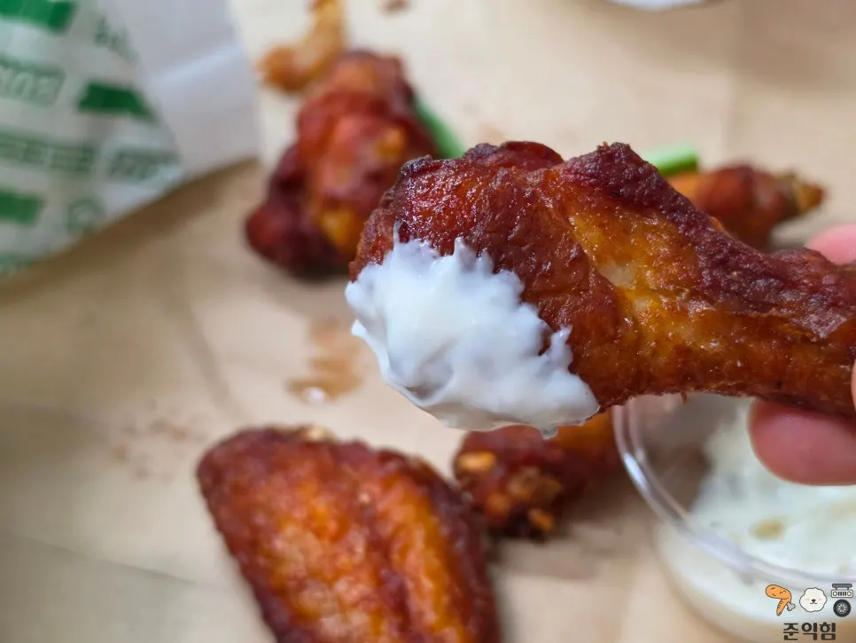 Buffalo wing drumstick dipped in sauce