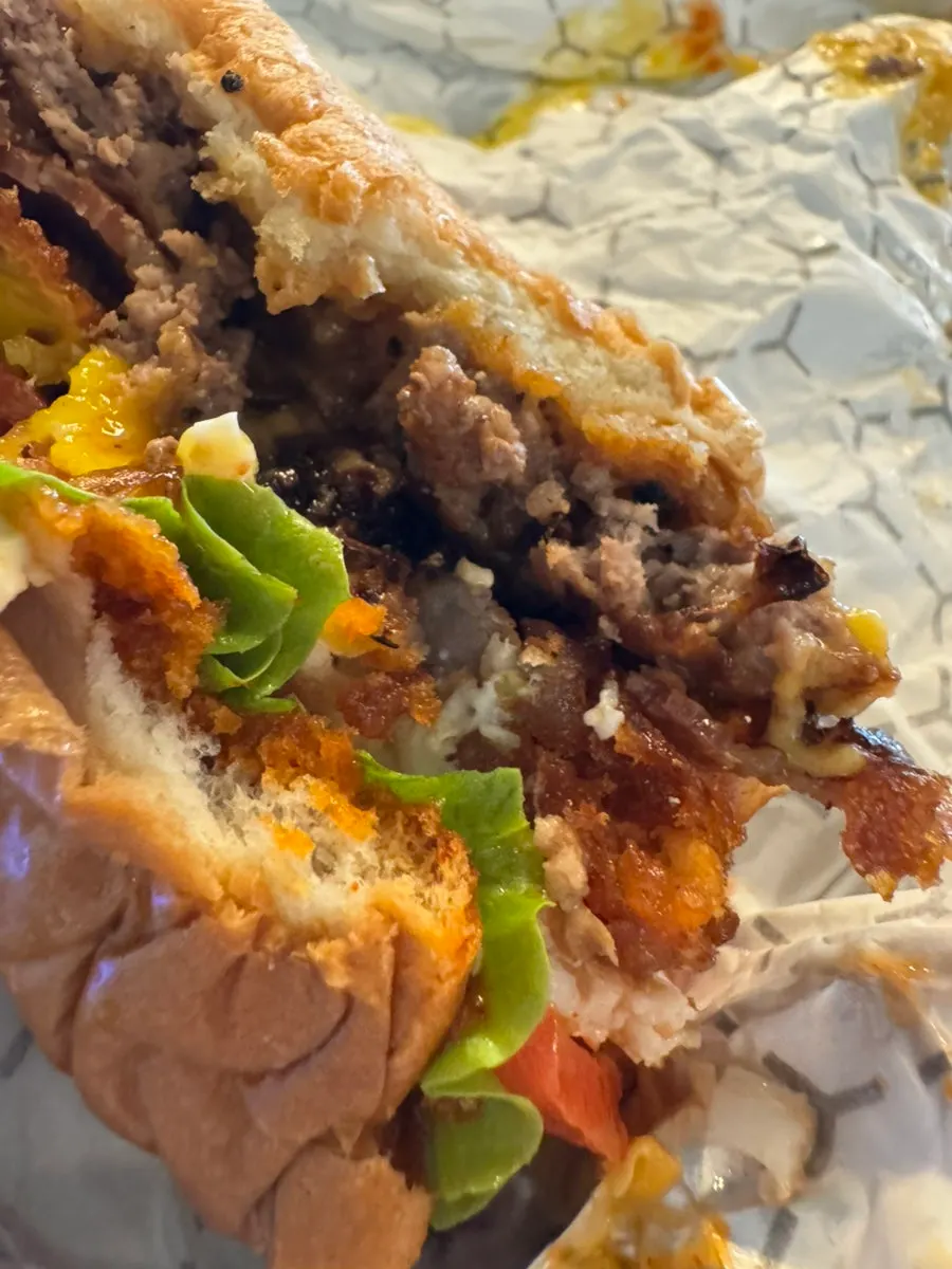 Cross-section of the Hangover burger showing bacon and fried egg