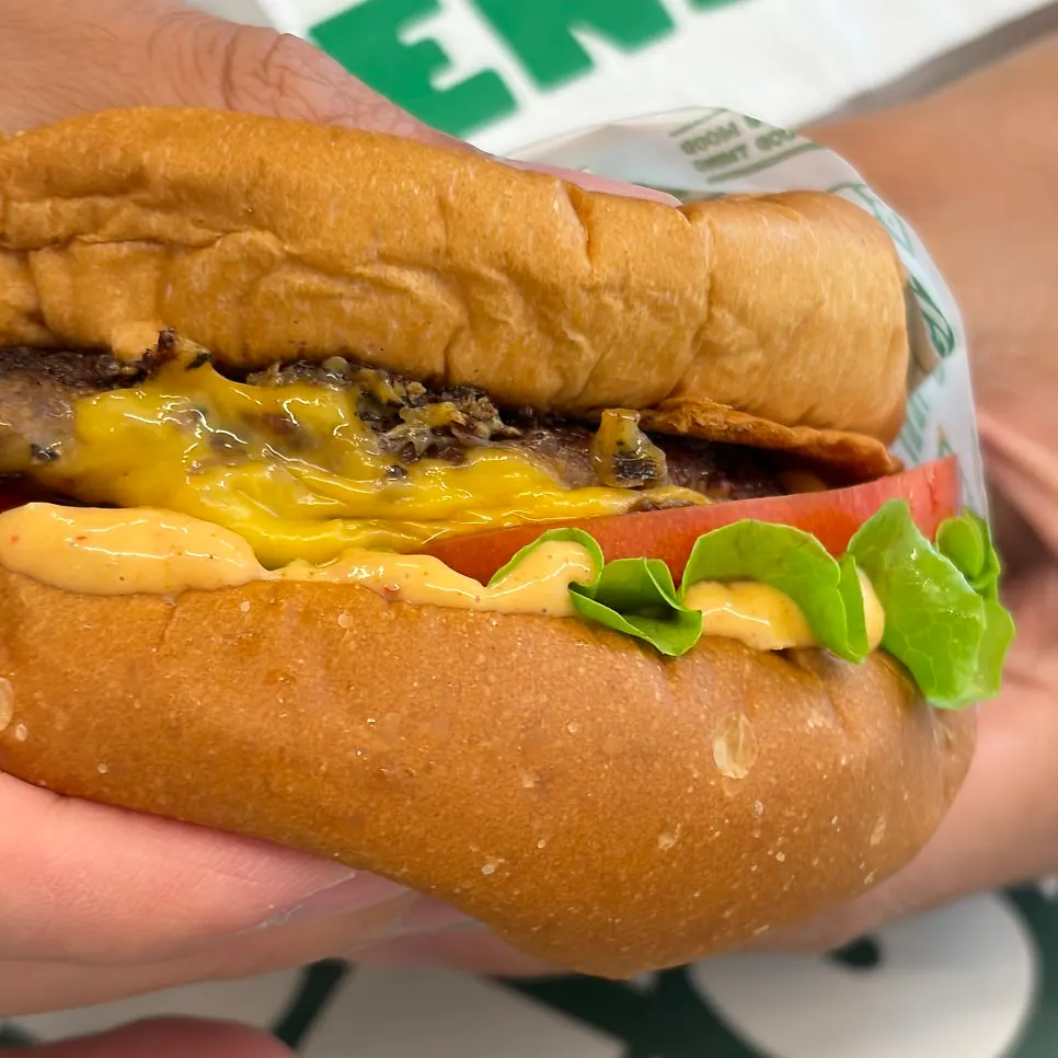 A bite taken out of the Cheese burger