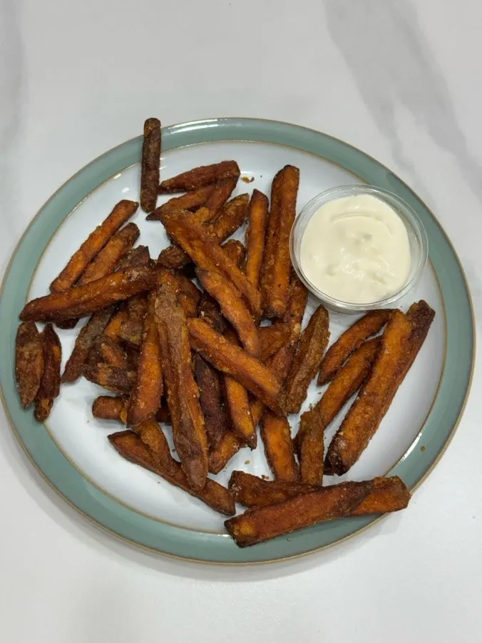 Sweet potato fry dipped in ranch sauce