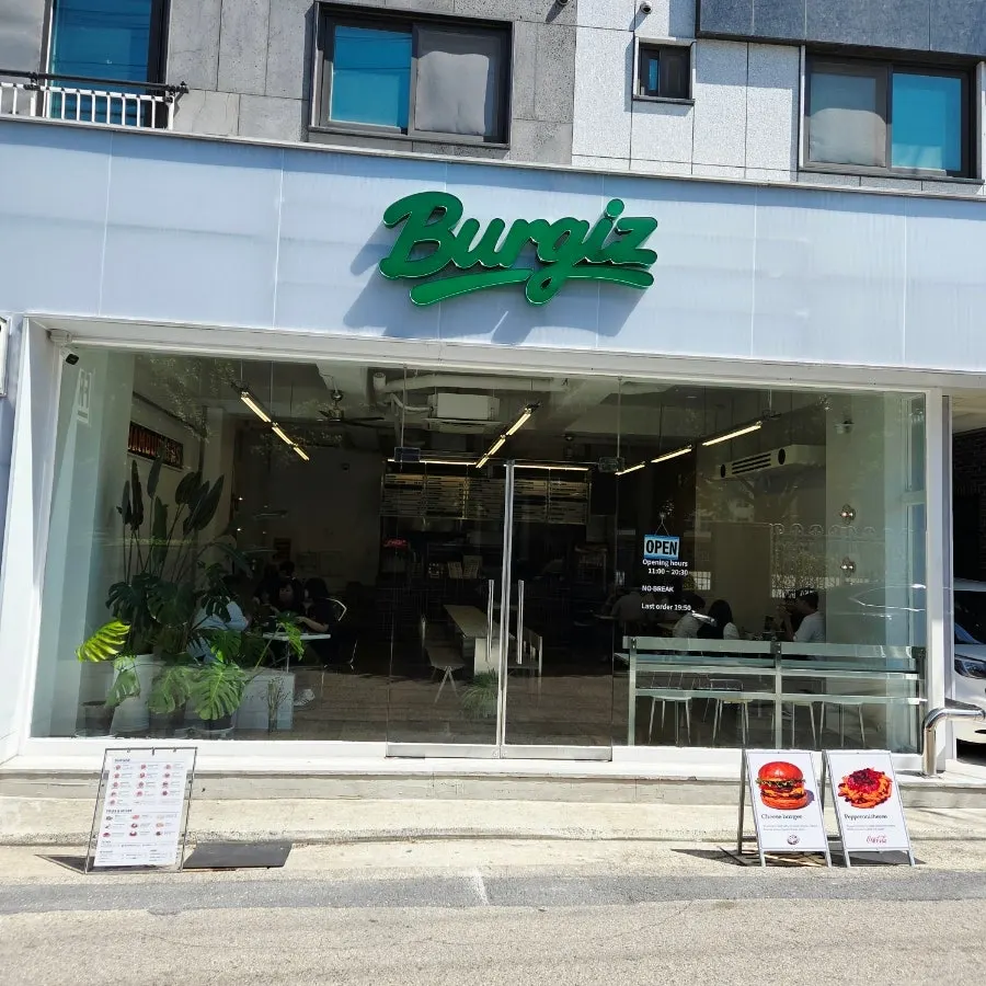 White exterior and green Burgiz sign