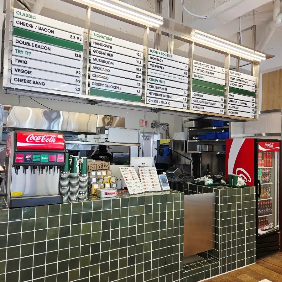 Store space accented with wood flooring and green plants