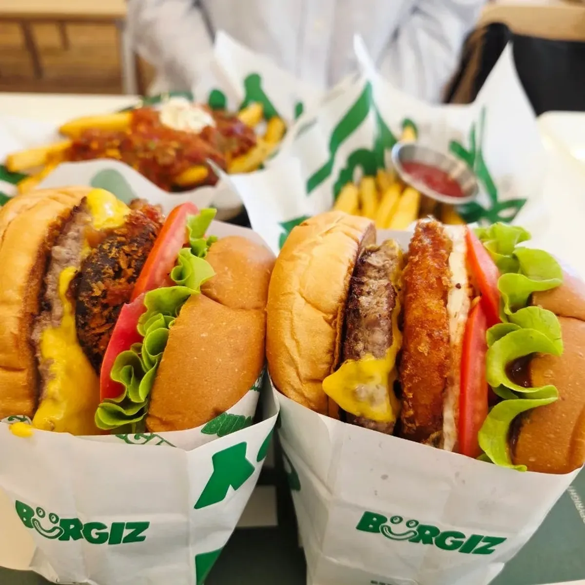 Table set with the Hangover set, Mushroom burger, and chili fries