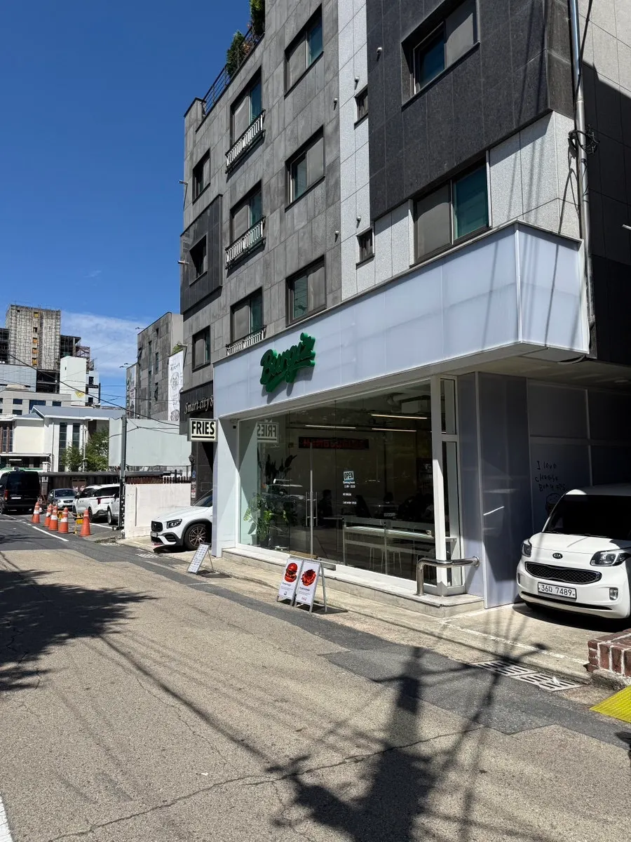 Storefront with the green Burgiz sign