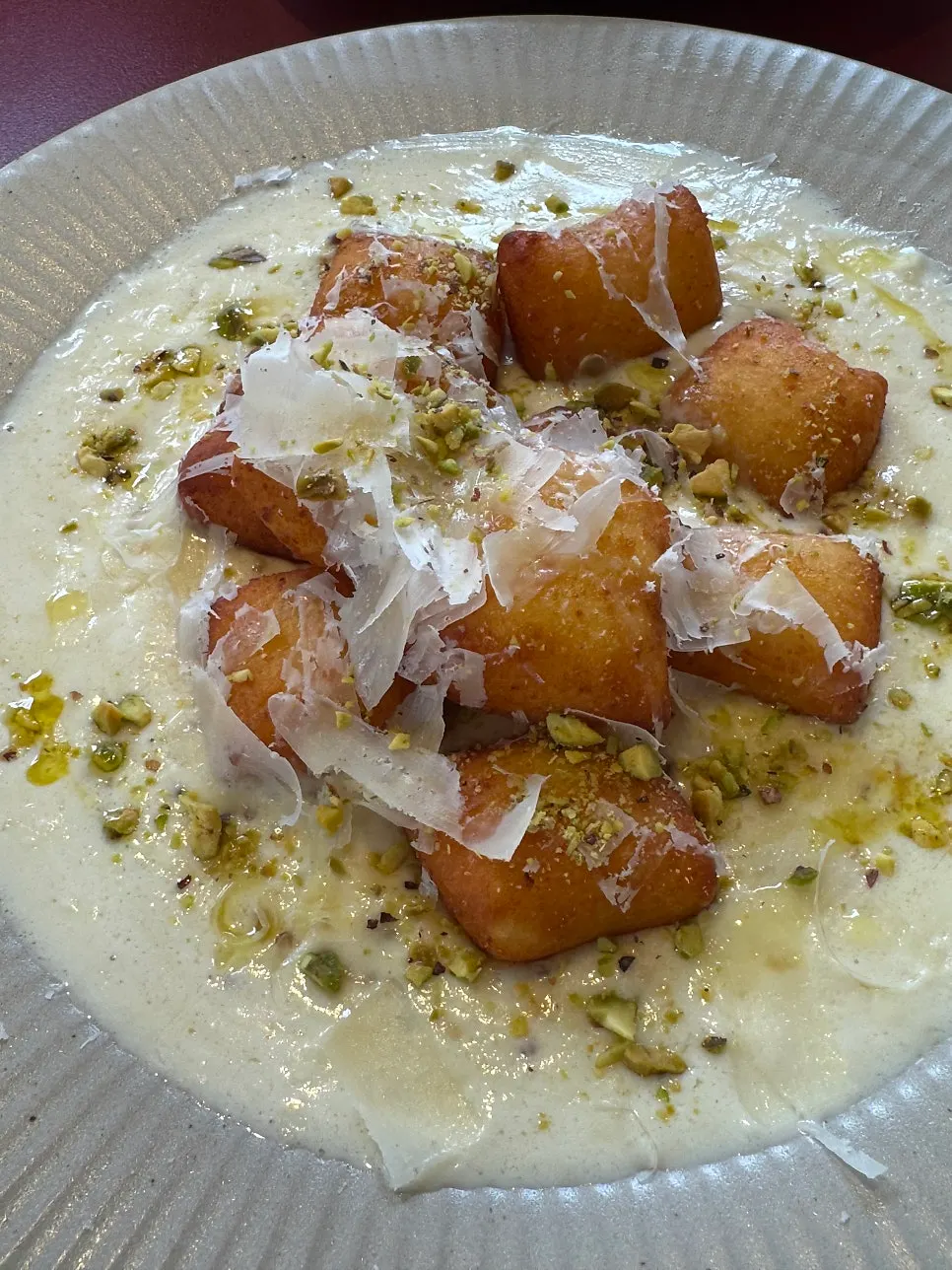Gnocchi bites served with cream sauce