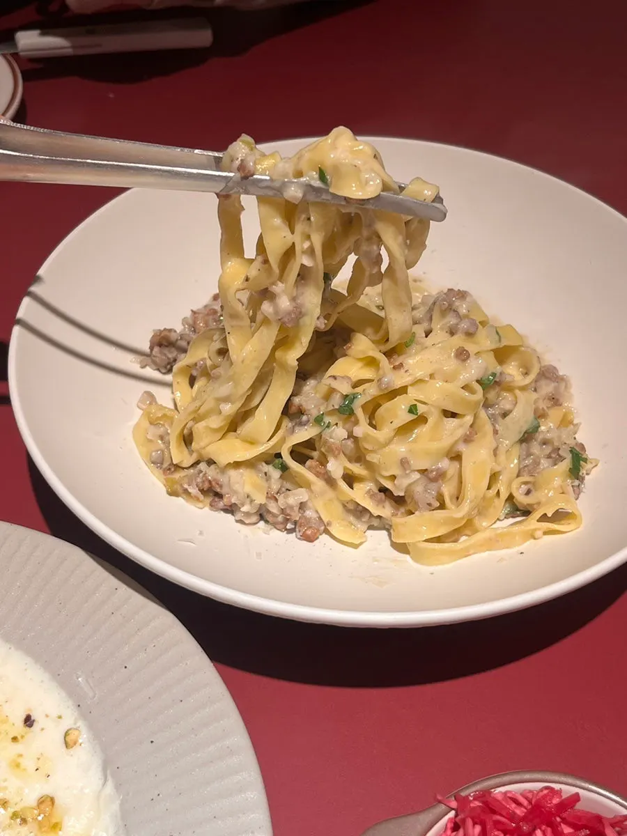 White ragù pasta showing chewy fresh noodles