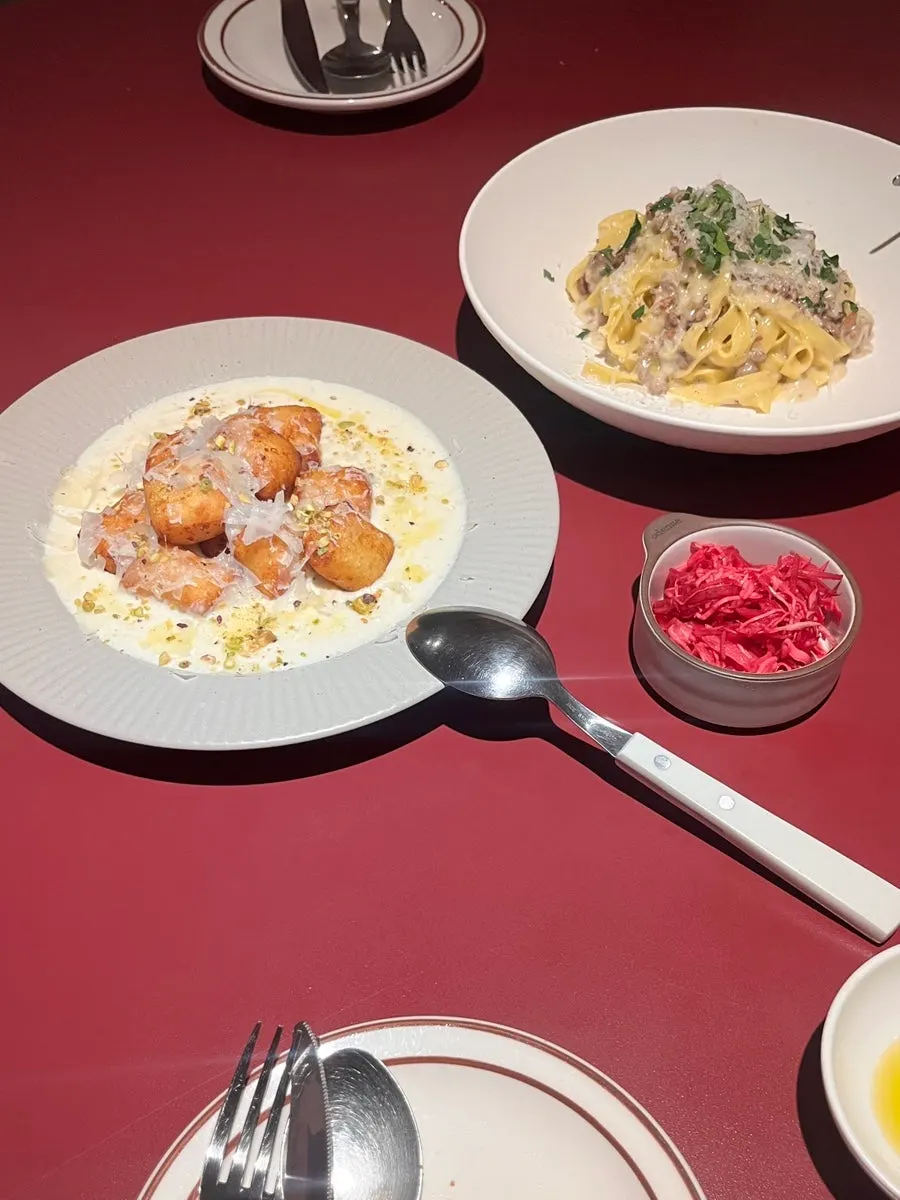 Red cabbage salad served alongside the pasta