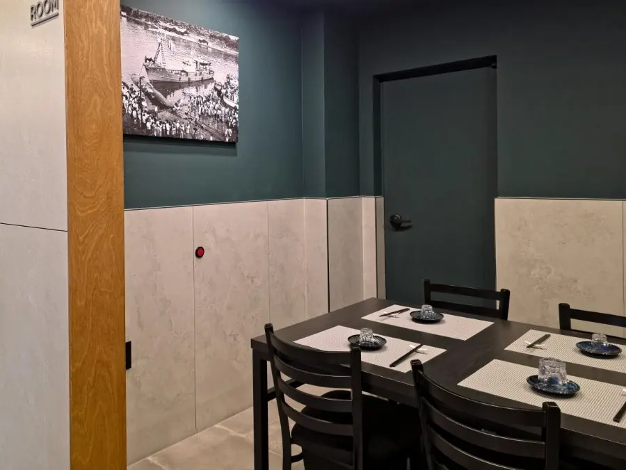 Passage and seating toward the restroom at the back of the restaurant