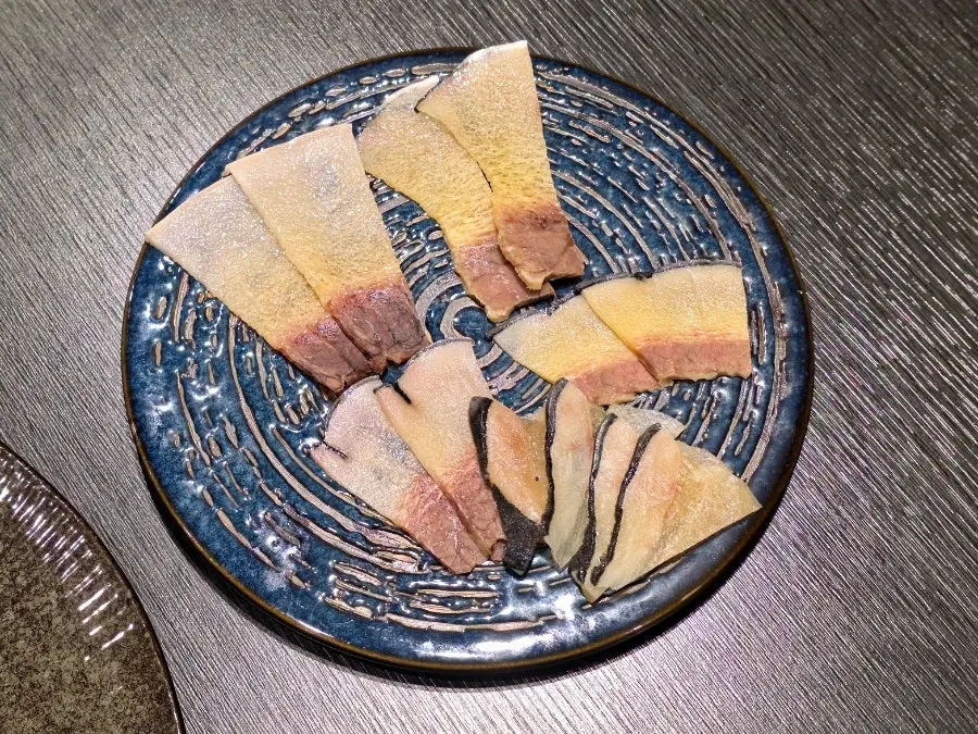 Tasting platter with sea urchin, tuna, salmon, and grilled eel