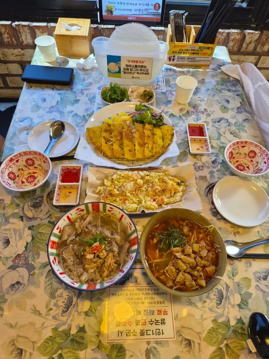 A full spread of pho and banh xeo