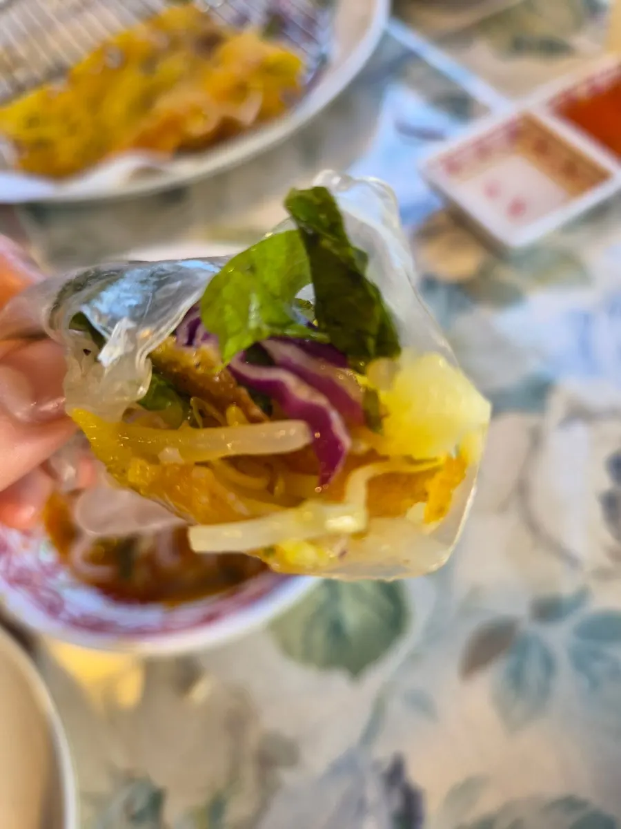 Banh xeo eaten with sauce
