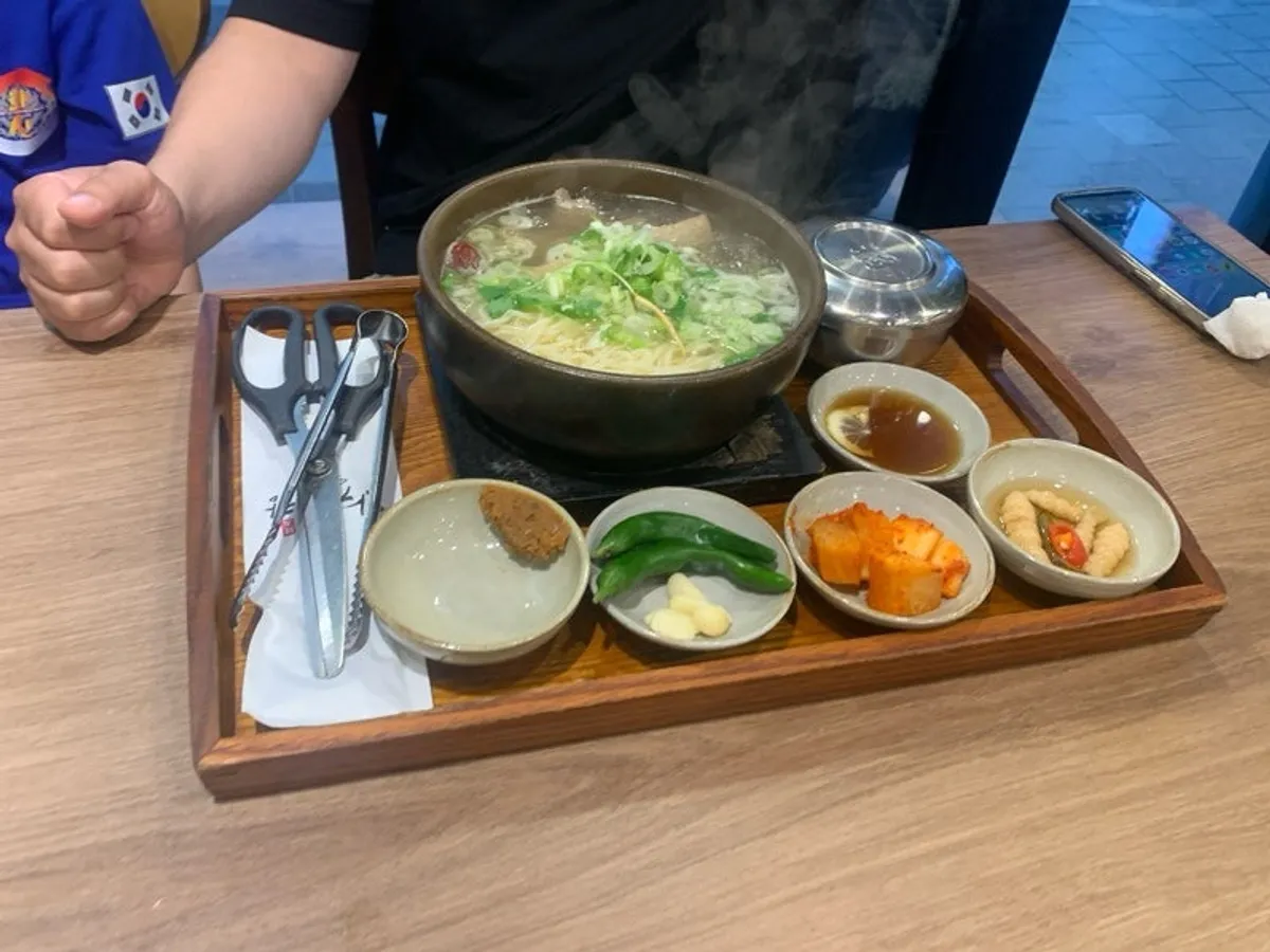 A table setting with two bowls of galbitang