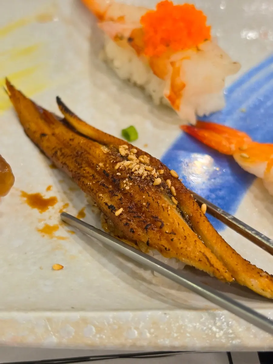Soy-marinated shrimp sushi included in the set
