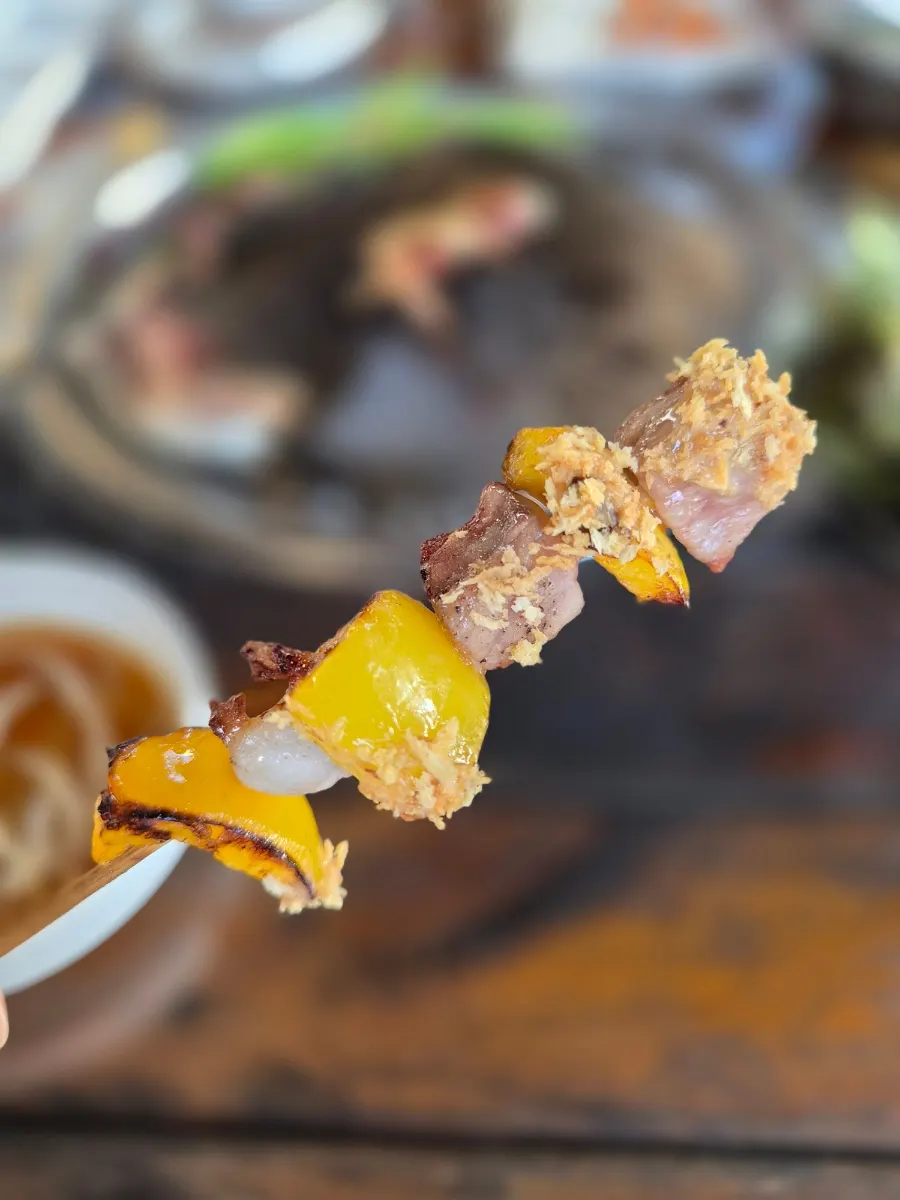 Skewers served with sauce and breadcrumbs