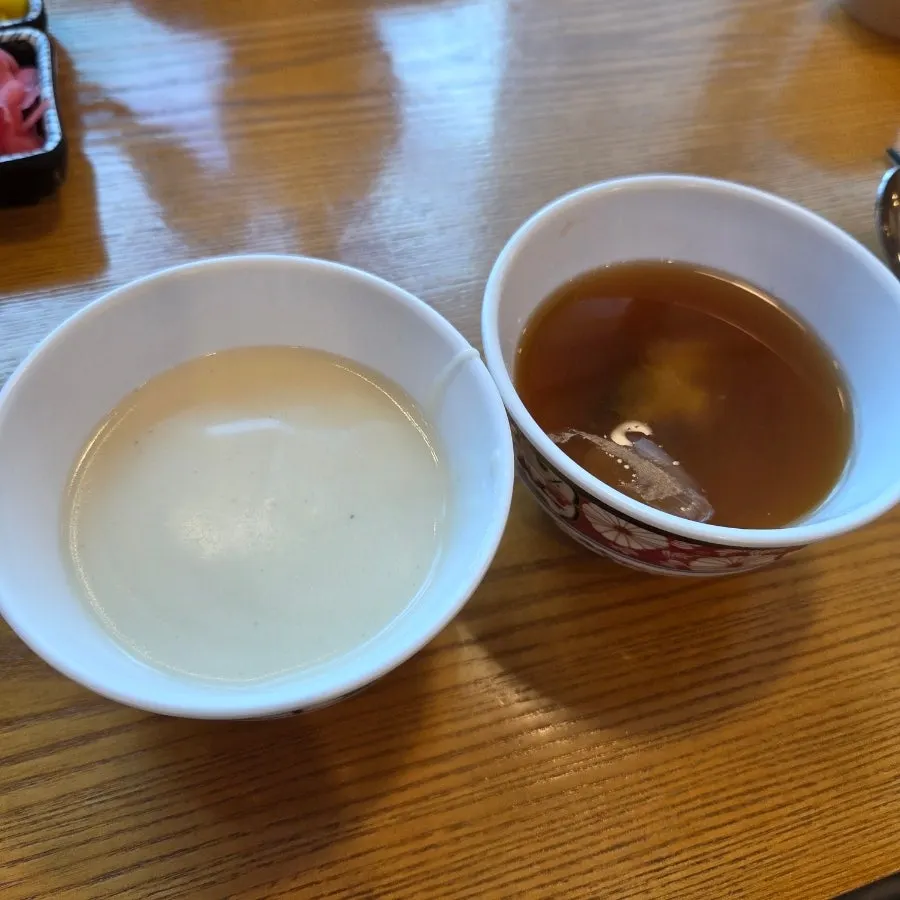Clear soup, cream soup, and white rice at the self-serve bar