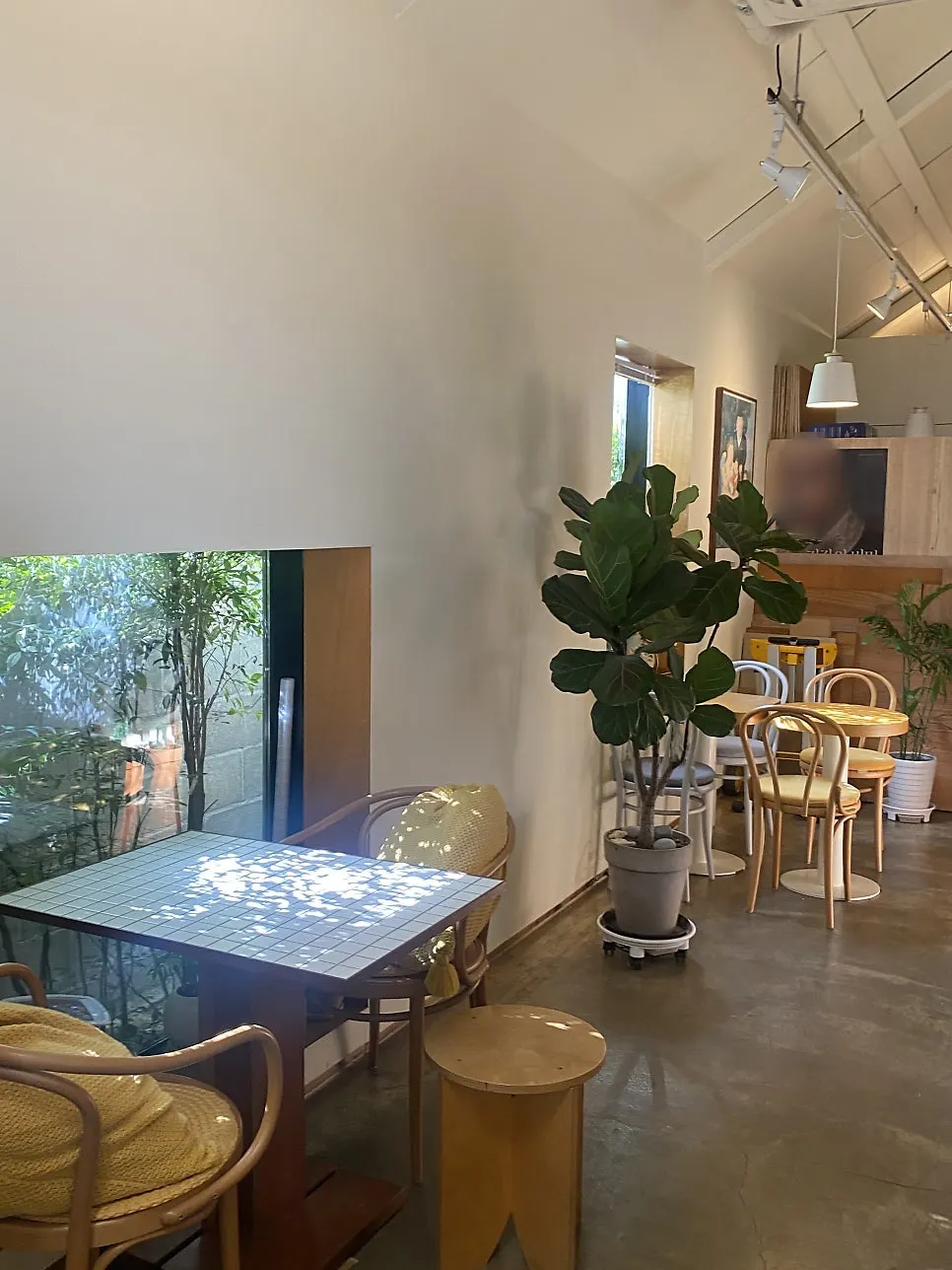 Seating at Buajang lit through the glass walls