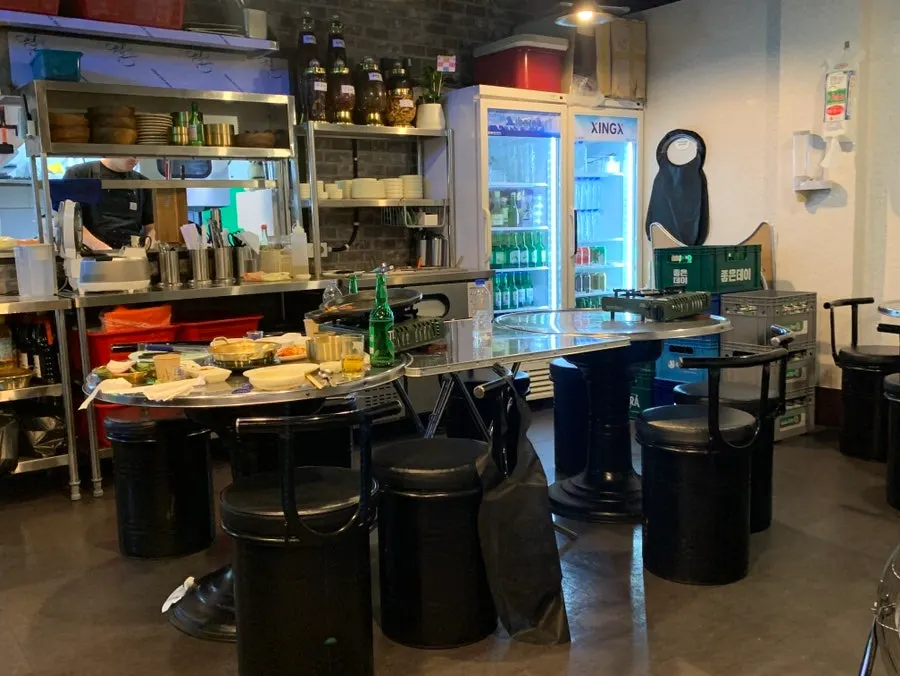 Interior view with Donnamu Jip's outdoor-stall atmosphere