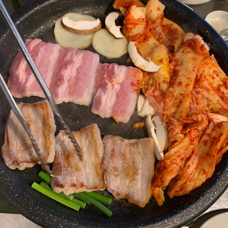 Pork belly and kimchi on the grill