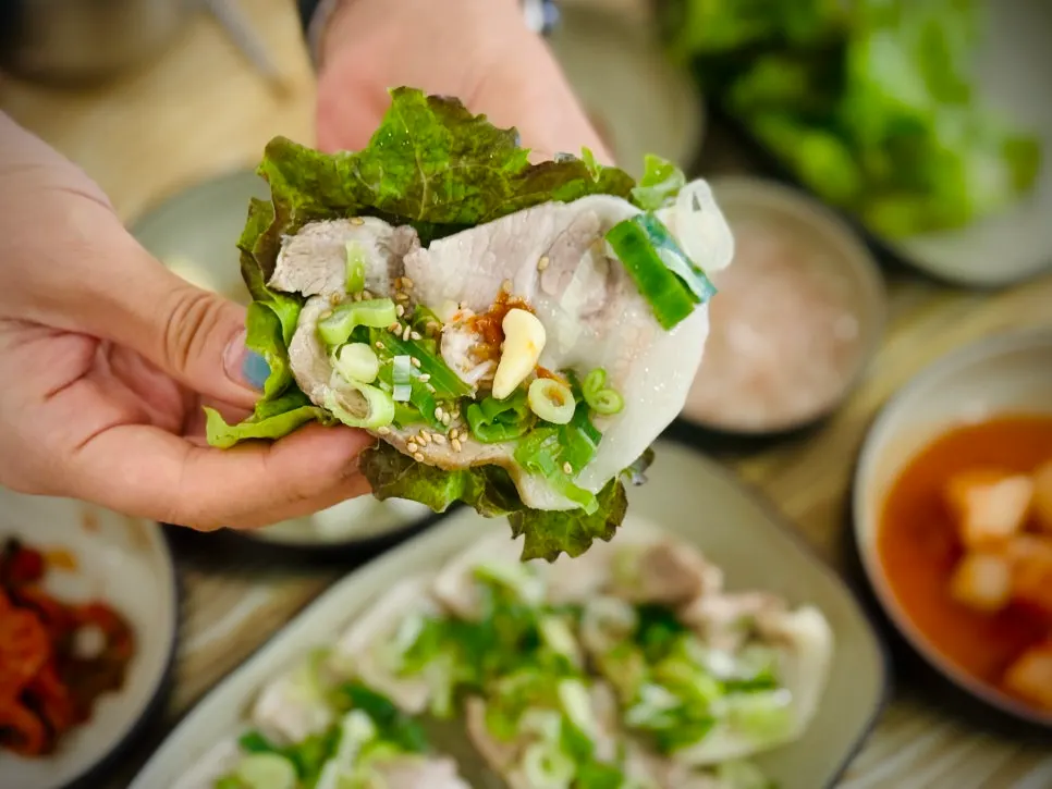 Boiled pork enjoyed with wrap vegetables