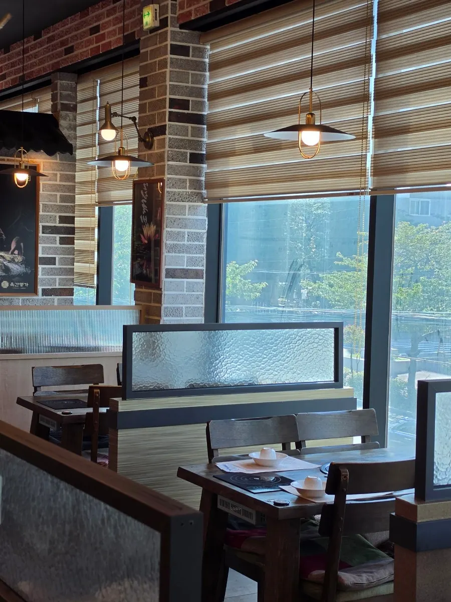 Spacious restaurant interior decorated with flowers