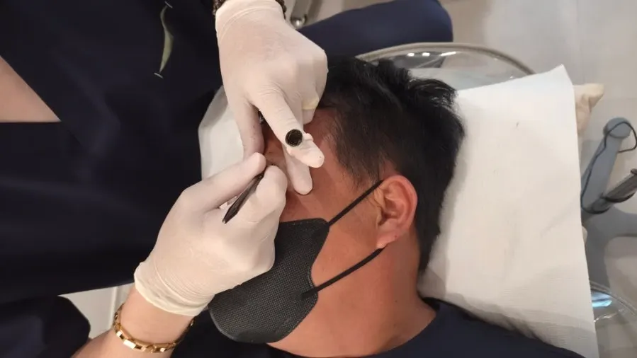 Line-work natural brow tattoo in progress