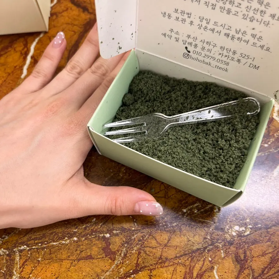 Small-size return-gift box held in hand