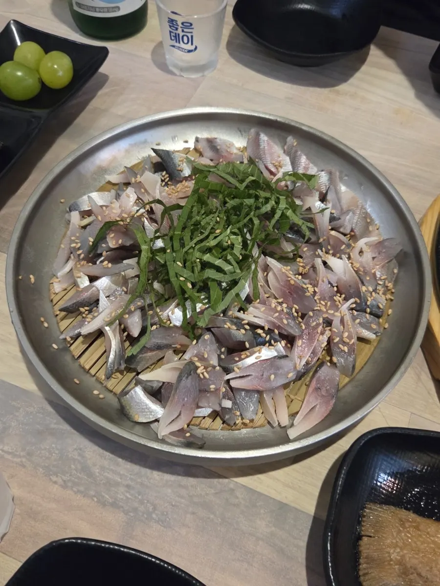 Side-dish spread with quail eggs and pickled dishes