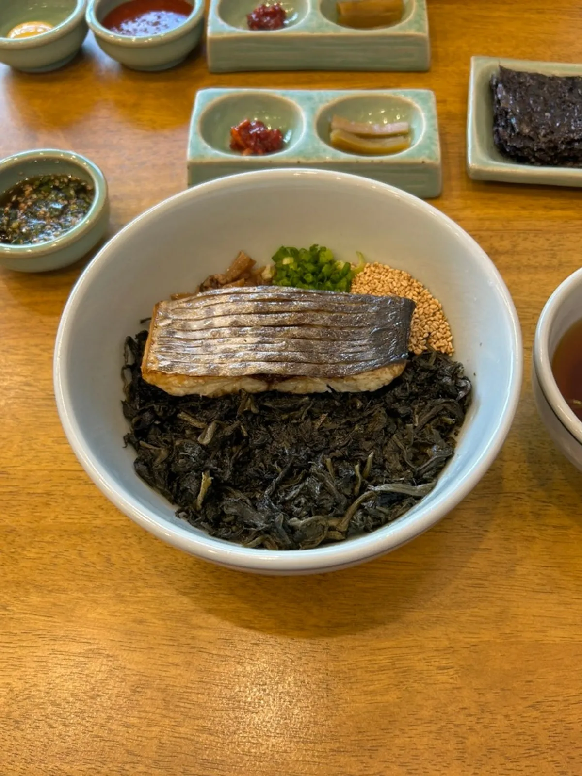 Mackerel gondeure rice topped with a large piece of grilled mackerel