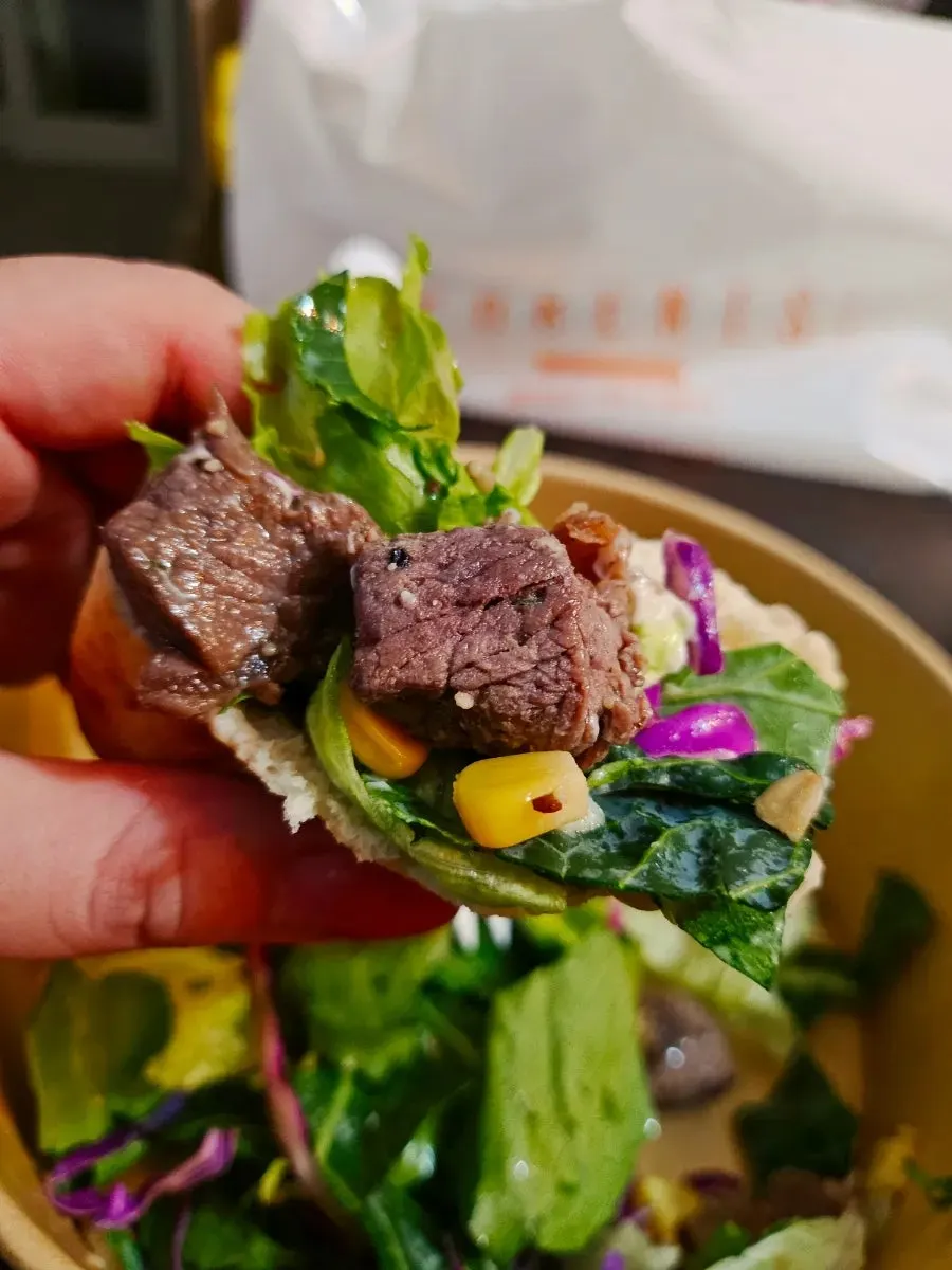 A packed salad bowl from PARENTS Coffee & Salad