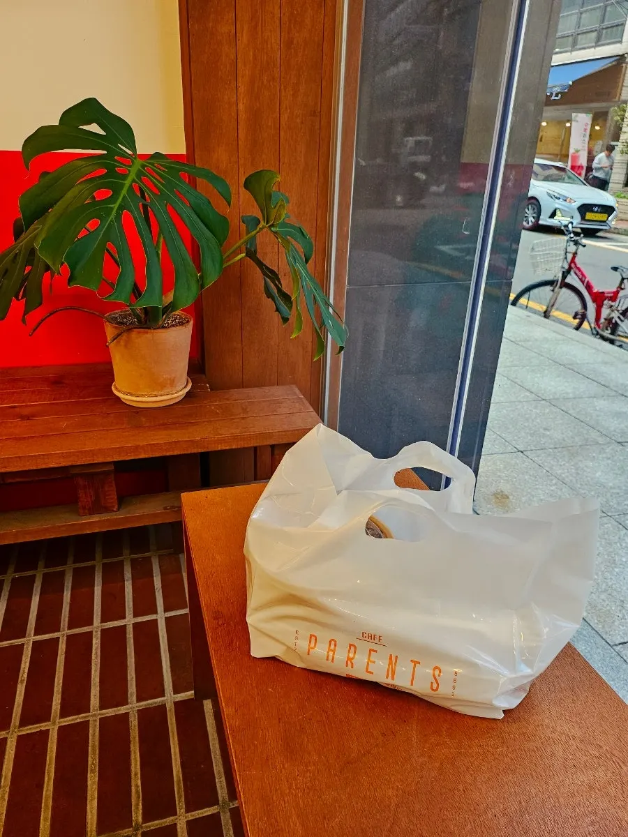Takeout containers of salad and poke