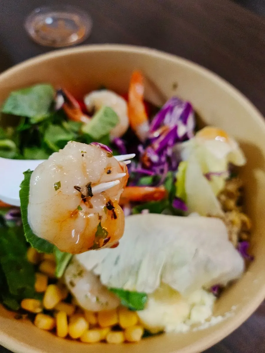 Shrimp salad with corn, granola and kaymak