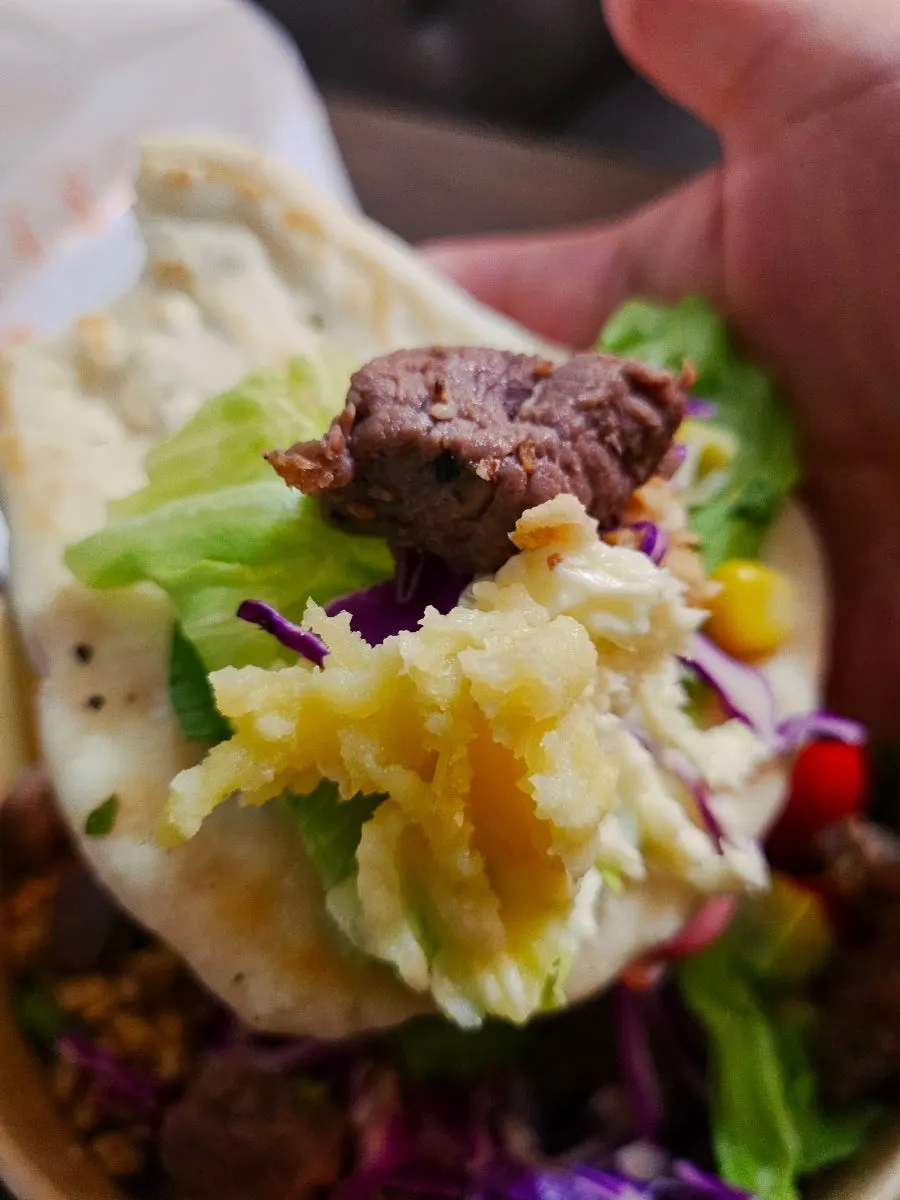 Generously portioned takeout salad container