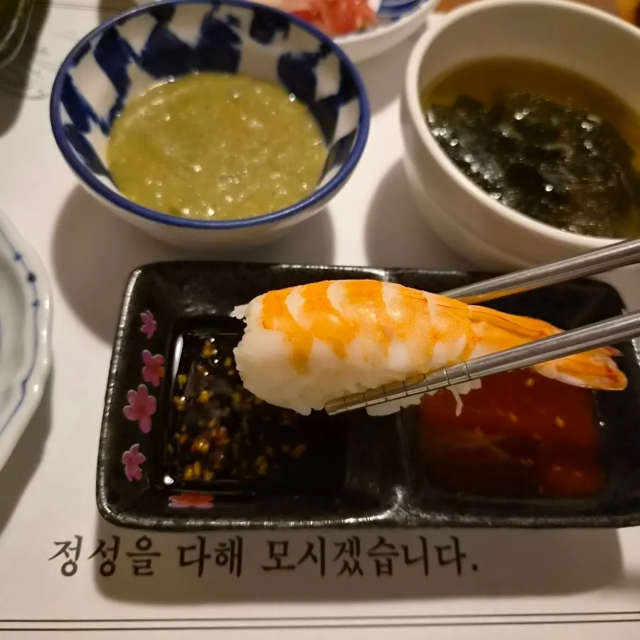 Chilled boiled pork, sushi, rolled omelet, and salad