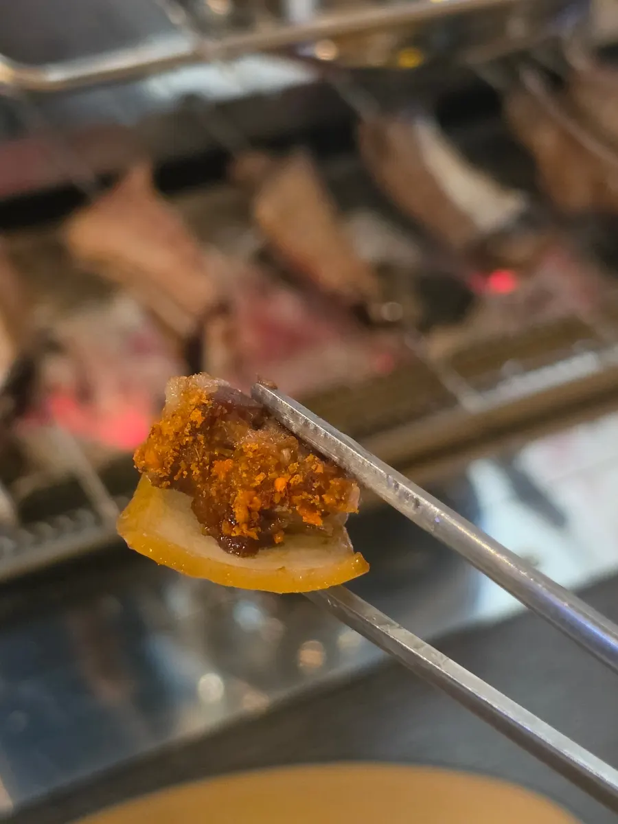 Lamb skewers dipped in jjaran