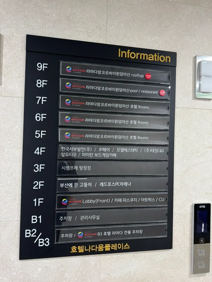 Building entrance and signage with basement parking