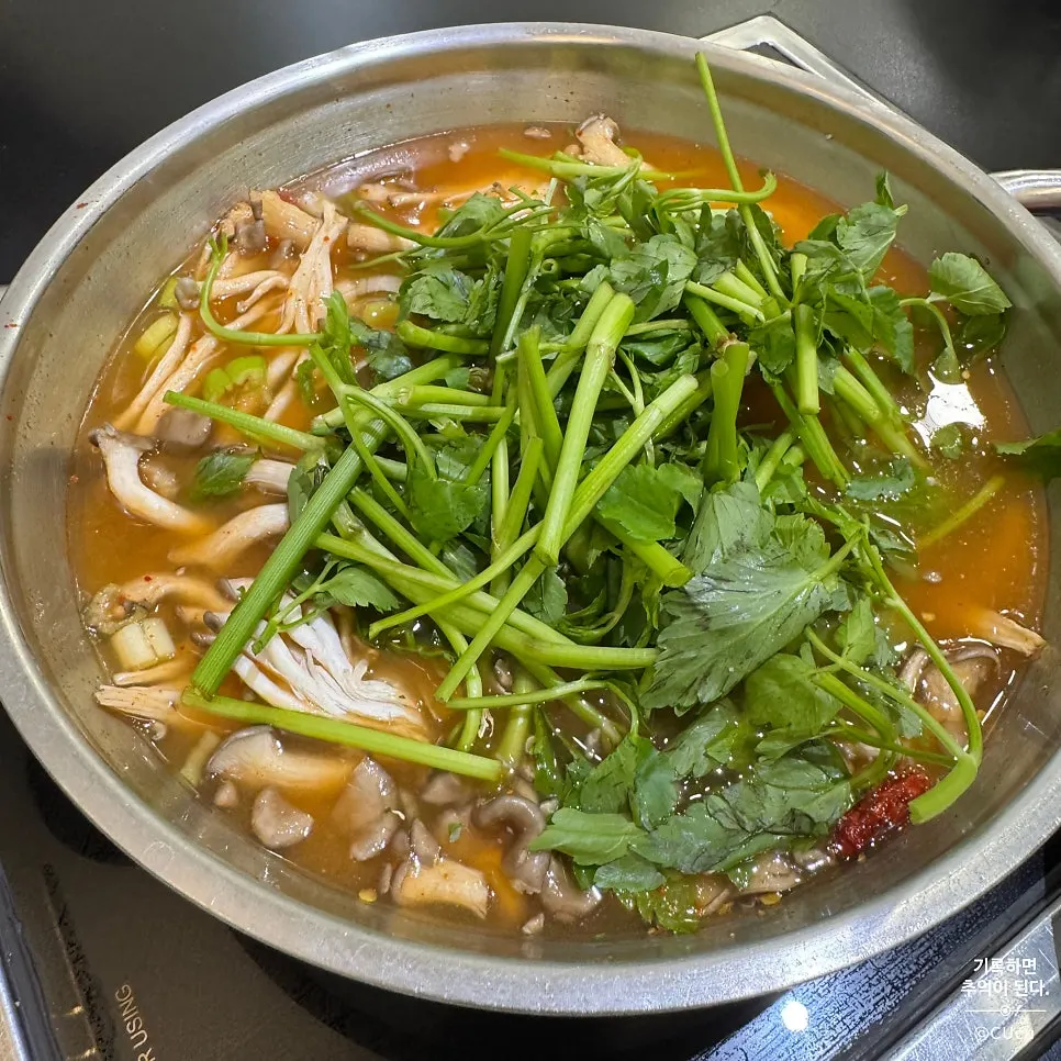 Shabu-shabu ingredients with minari and mushrooms