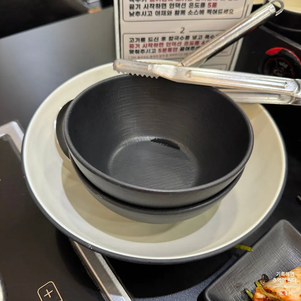 Shabu beef going into bubbling broth