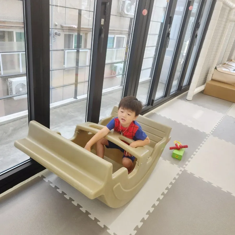 Indoor seesaw used by a child