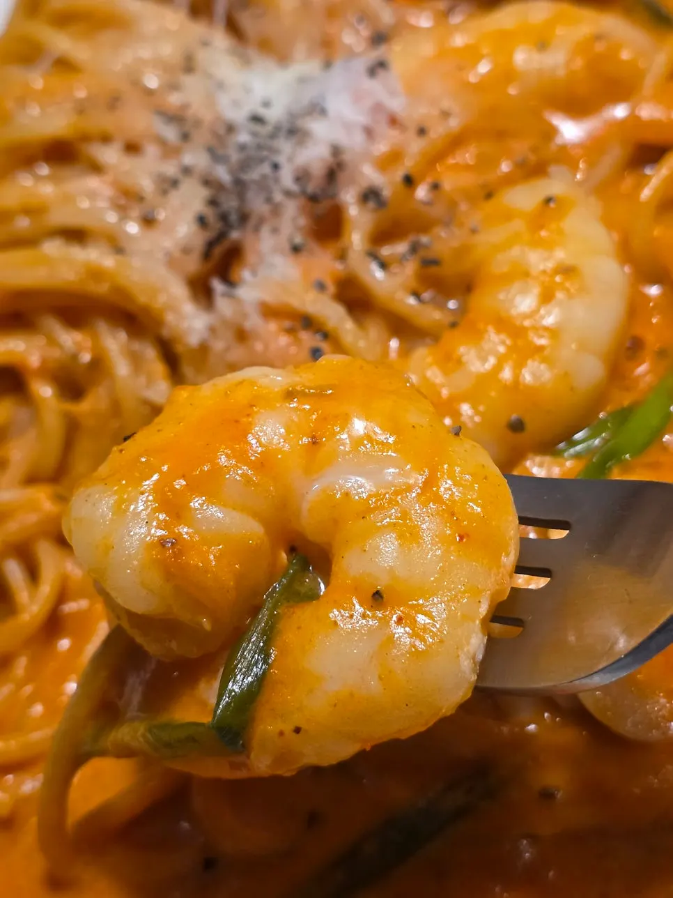 Meal scene with rosé pasta