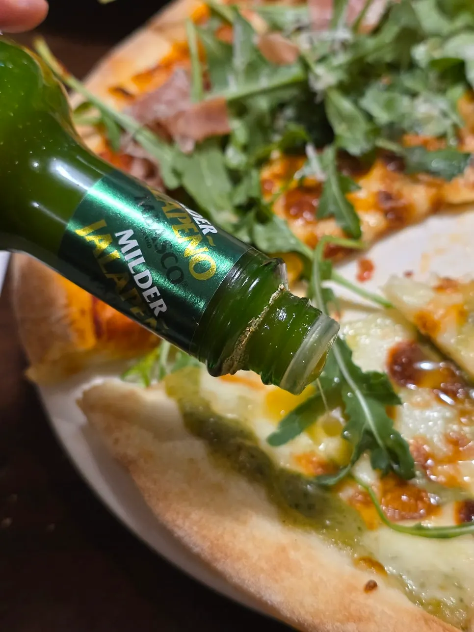 Green hot sauce and pizza