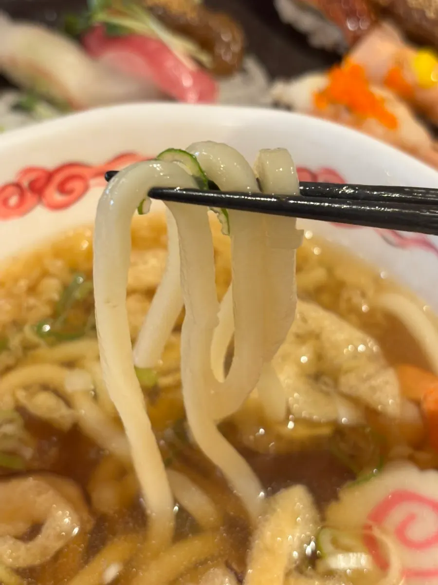 Udon with crown daisy and fried tofu