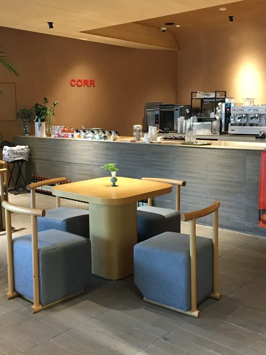 CORR interior with large windows and spacious seating