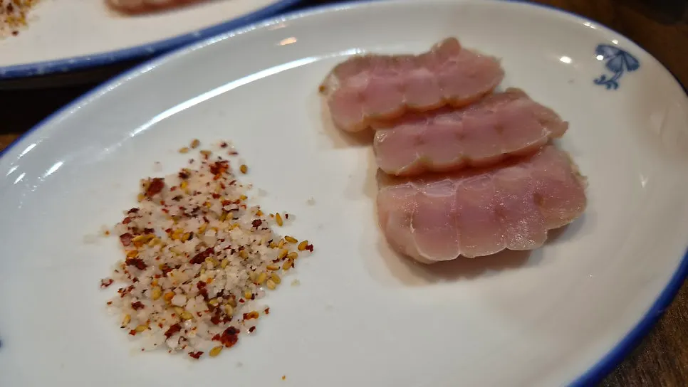 Thinly sliced pufferfish sashimi plated
