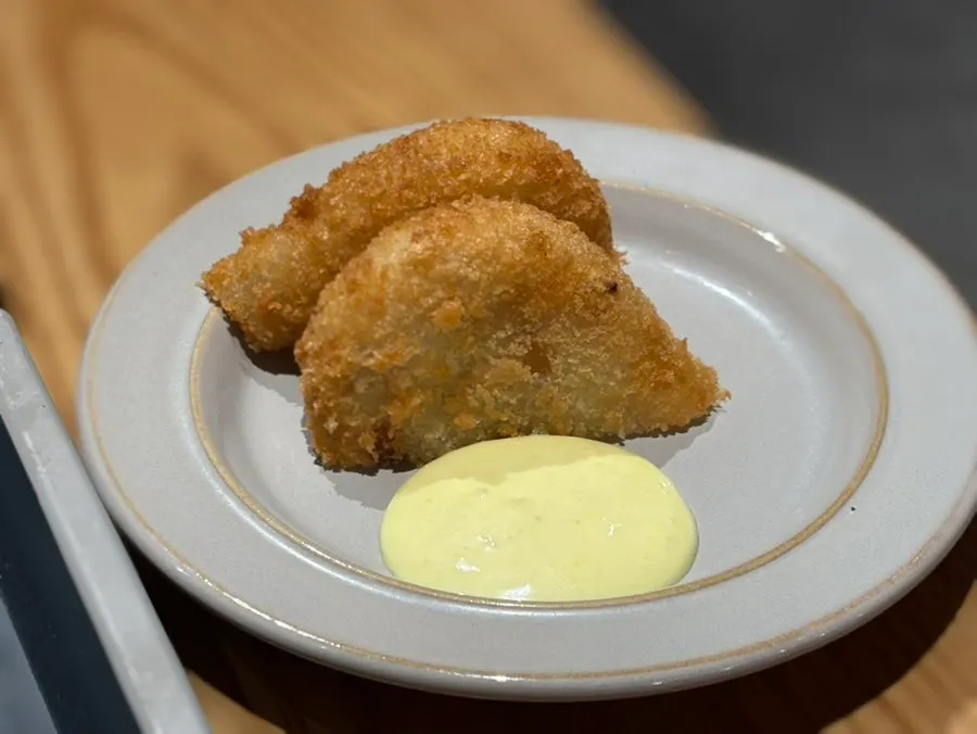 Potato croquette served cut in half